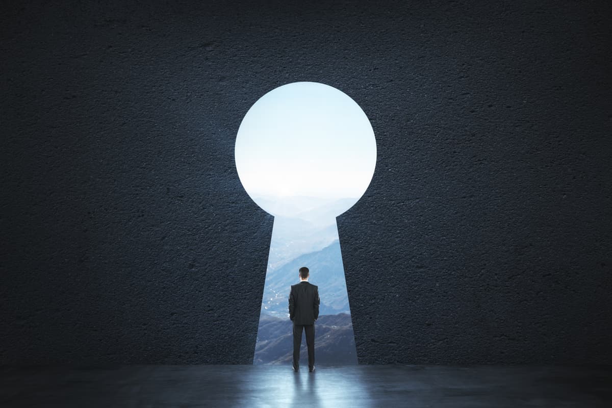A man standing in front of a keyhole.