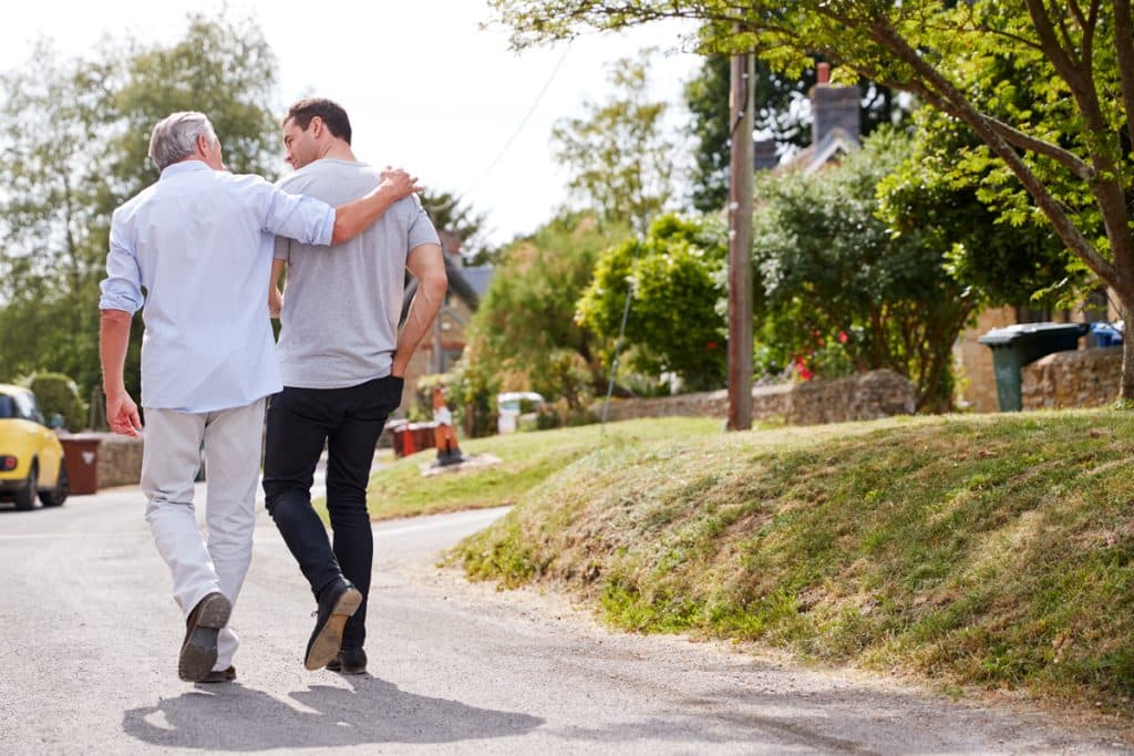 Two men walking and mentoring each other in christ.