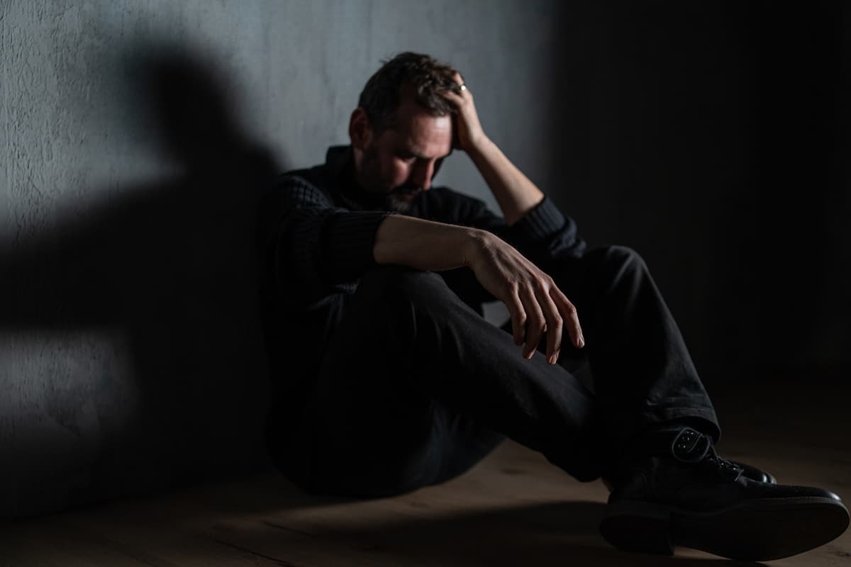 A young man in distress while alone.